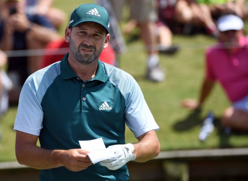 Sergio Garcia checks yardage from the 18th tee box during the third round of The Players Champion