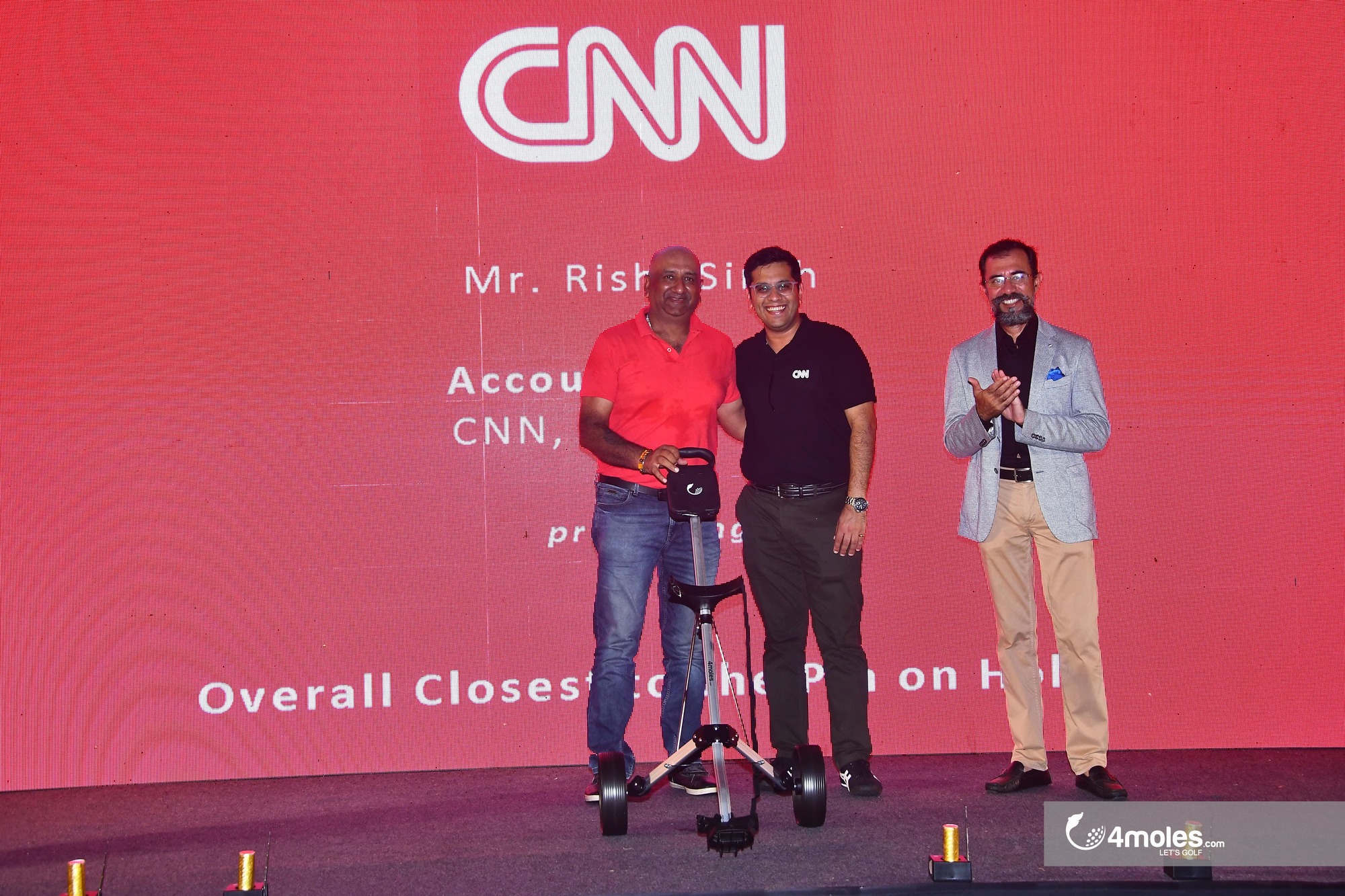 Amit Mishra getting prize of 2 Wheel Golf Trolley by Mr. Rishi Rai, Account director, South Asia, CNNand Dinesh Thakur