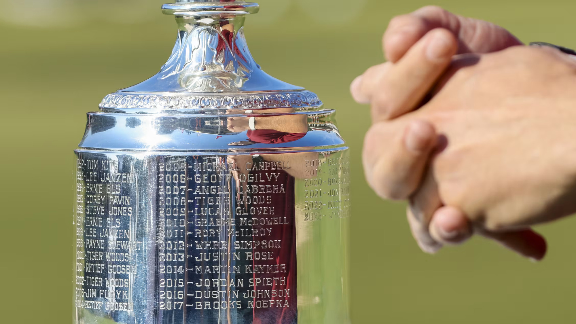 Fans are able to get a glimpse of the U.S. Open Trophy and all of the engraved champions on-site at Pinehurst No. 2.  (Image via Gettyimages)