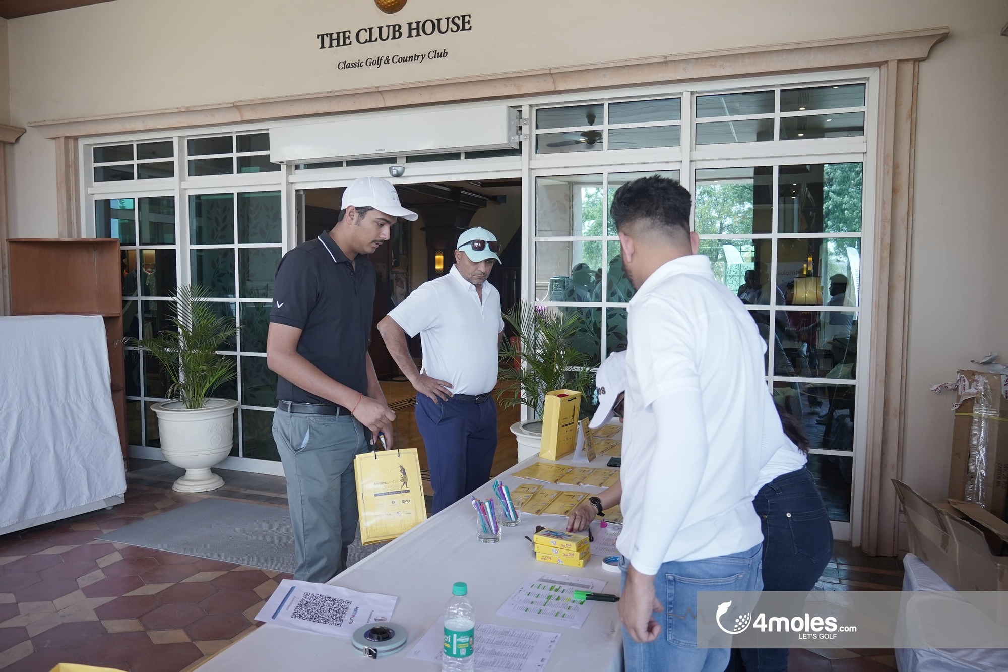 Golfer collecting the goodie bag
