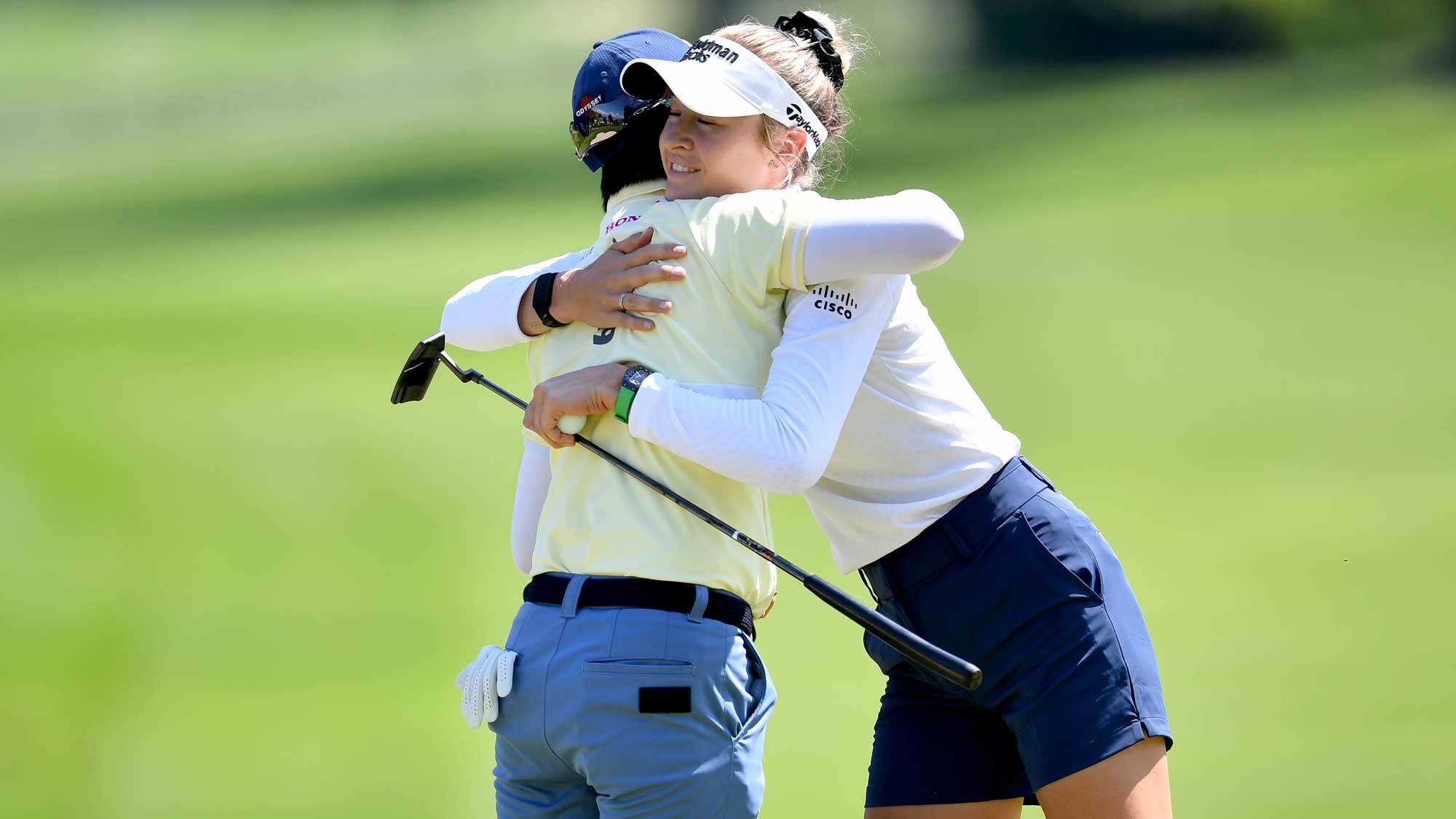 Nelly Korda of the United States gives a hug to Yuka Saso of Japan