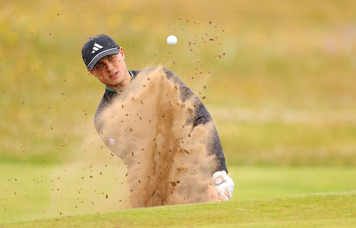 Ludvig Aberg plays a bunker shot on the second hole. (Image via Gettyimages)