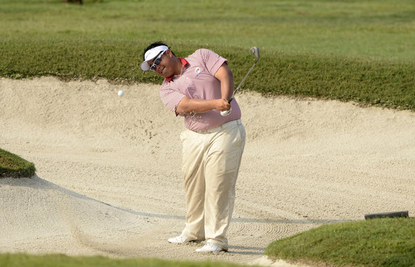 Kiradech Aphibarnrat of Thailand hits out of a bunker during the first day
