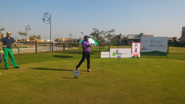Mr. Munish Patell tracks his ball after hitting his shot from the 11th Tee