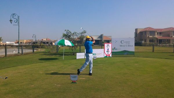Mr. Devang Shah hits a tee shot on the Par-3 11th