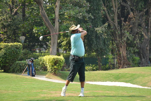 Abhay Kanoria tracks his ball's flight after a drive at the Willingdon Golf Club - Mumbai