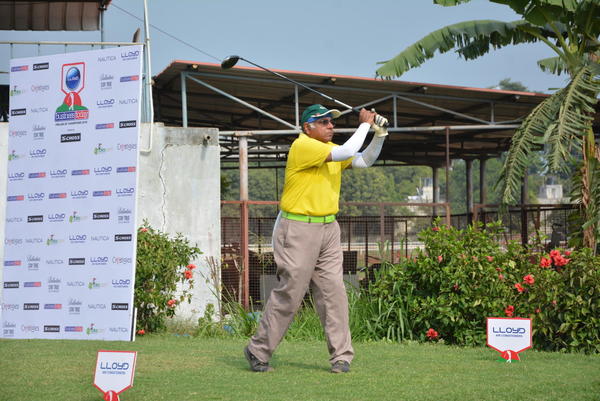 Krishnakumar.B tracks his golf ball after a tee shot