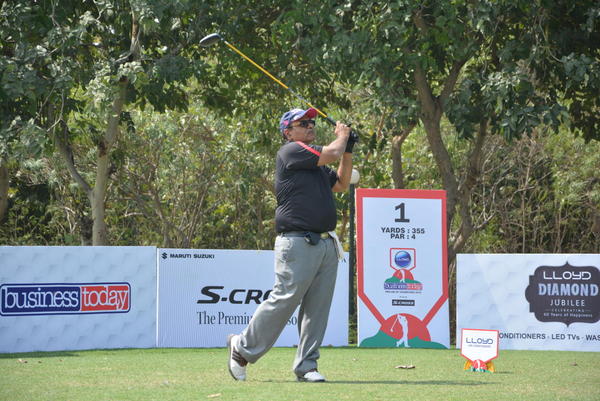 Varinder Sewak tracks his ball at the Classic Golf & Country Club