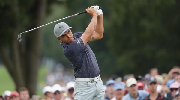 Rickie Fowler plays his shot from the eighth tee during the first round of the 2017