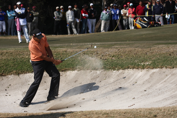 Arjun Atwal clears a bunker at the Indian Masters