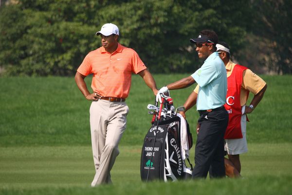 Tiger WOODS with Thongchai JAIDEE on day one of the WGC HSBC Champions 2009