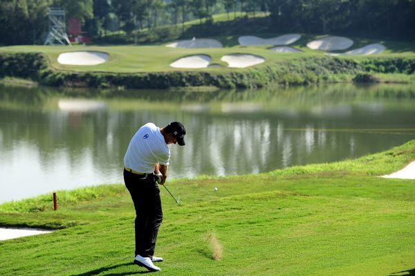 Robert Karlsson of Sweden plays a shot during practice for the Omega Mission Hills World Cup