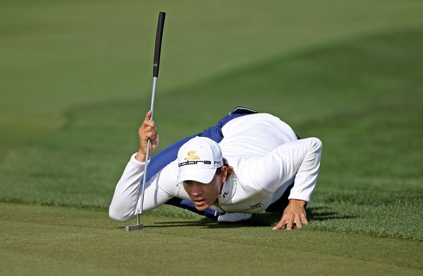 Camilo Villegas of Colombia lines up a putt during the first round.