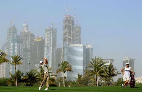 Charl Schwartzel of South Africa plays his second shot at the par 5, 13th hole during the first round.