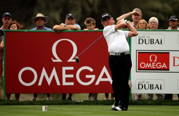 Miguel Angel Jimenez of Spain hits his tee-shot on the 18th hole during the second round.