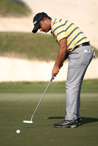 Rahil Gangjee (IND) putts during the final round