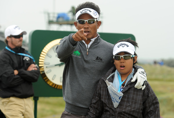 Thongchai Jaidee (THA) poses with his son during practice