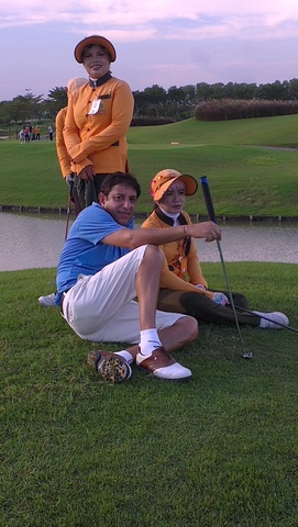 Ajay.. with our lady caddies ... Great fun day ... and a great game with new golf friends.