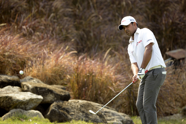 Indian golfer Anirban Lahiri hits a chip shot on Day 1