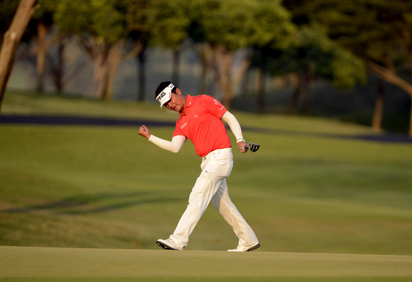 Lin Wen Tang of Chinese Taipei exults after a putt